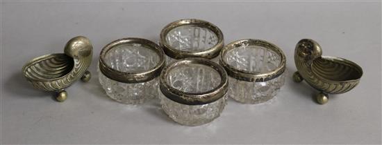 A set of 4 silver mounted glass salts and a pair of plated shell salts.